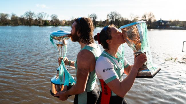 Image of From left, Seb Benzecry and Jenna Armstrong, ˮAV students and Cambridge University Boat Club Presidents kiss the Boat Race trophies.Pic credit: Nordin Catic