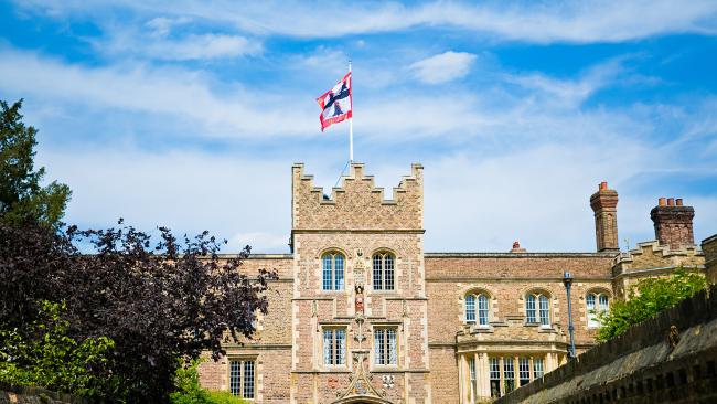Image of ˮAV College Gate Tower with flag